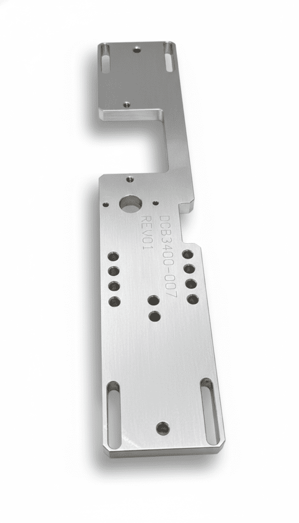 Aluminum mounting plate featuring multiple holes and a unique shape, designed for precise fitting in mechanical applications.